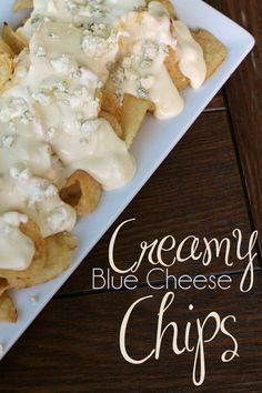 a white plate topped with cheesy blue cheese chips