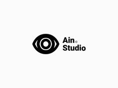 the logo for an art studio with black and white circles on it's side