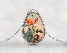 Step into a world of blooming beauty with the Blossom Enchantment Pendant. This exquisite necklace captures the essence of a magical garden, where flowers and fairies dance together in harmony. Inspired by the delicate beauty of botanical gardens and the whimsical charm of fairy tales, this pendant is perfect for those who appreciate the elegance of nature and the nostalgia of cottagecore. The pendant showcases a beautifully detailed flower surrounded by botanical elements, all set within a vint Necklace Fairy, Fairies Dancing, Botanical Elements, Fairy Necklace, Necklace Flower, Magical Garden, Delicate Beauty, Limassol, Aluminum Prints