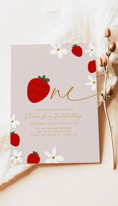 a pink and gold birthday party with strawberries on the front, daisies in the back