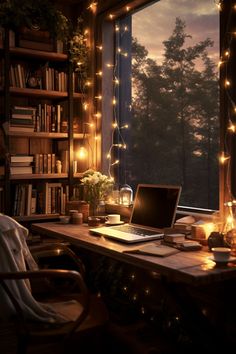 an open laptop computer sitting on top of a wooden desk in front of a window