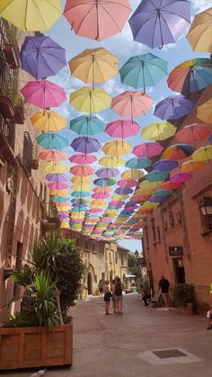 Rainbow Umbrellas at Poble Espanyol in Barcelona, Spain Vision Board Pictures Travel Spain, Barcelona Spain Travel Aesthetic, Poble Espanyol Barcelona, Summer In Barcelona Aesthetic, Barcelona Spain Beach, Spain Barcelona Aesthetic, Barcelona Beaches, Poble Espanyol