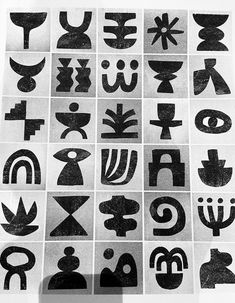 black and white photograph of different type of symbols in squares on a sheet of paper