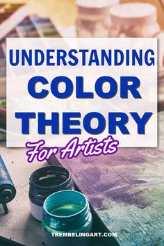 the words, understanding color theory for artists on top of a table with paint and brushes