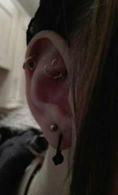 a person with ear piercings on their ears