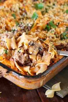 a casserole dish filled with pasta and meat