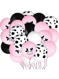 a bunch of balloons with black and white cow designs