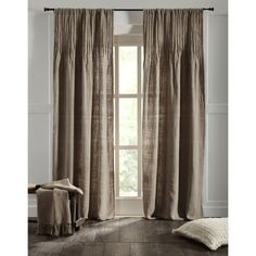 the curtains in this room are made from linen and have ruffled trims on them