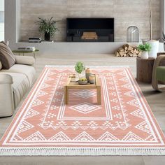 a living room with a large rug on the floor and a fireplace in the background