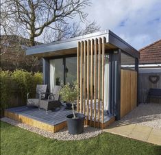 a small backyard with a deck and patio furniture