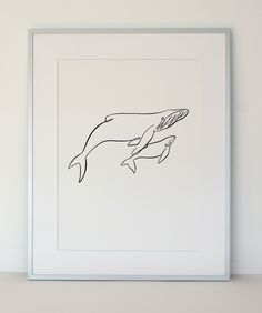 a black and white drawing of two dolphins