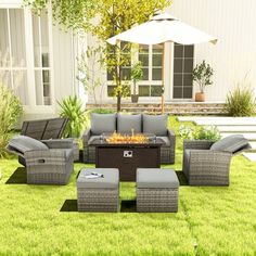 a fire pit sitting on top of a lush green field