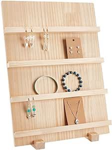 a wooden display case with jewelry on it