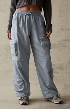 PacSun offers comfort and style in their new Extreme Nylon Cargo Pants. Designed for the bold and adventurous, these pants push the boundaries with their innovative design, combining zipper cargo utility pockets with a lightweight nylon construction. They get finished off with a flattering low-rise, a comfortable baggy fit, and adjustable drawcords at the waist and ankles.


	Solid color pants
	12" rise
	30" inseam
	Lightweight construction
	Low-rise
	Drawstring waistband
	Cargo zipper