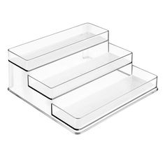 three clear acrylic trays stacked on top of each other