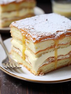 a piece of cake sitting on top of a white plate next to a knife and fork