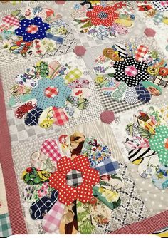 a patchwork quilt with many different designs on it