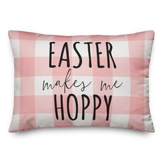 a pink and white pillow that says, easter makes me hoppy