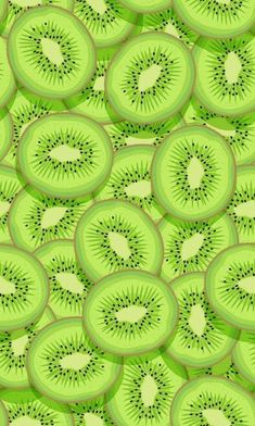 a bunch of kiwi slices on a green background