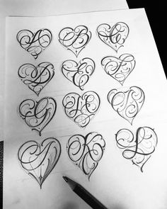 some type of calligraphy with hearts on it