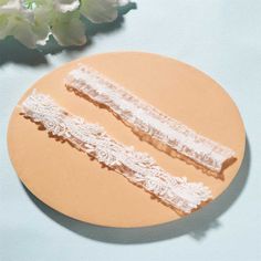 This soft white Wedding Lace Garter for Brides is a beautiful addition to any wedding ensemble. Made from delicate floral lace, this garter is the perfect touch to make your special day even more special. ✧ band approx 1 1/8 inches (3cm) wide✧ Band size approx 15 - 23 inches, (38 - 58cm) Adjustable Lace Bridal Accessories For Ceremony, Adjustable White Bridal Accessories For Bridal Shower, Adjustable Lace Bridal Accessories For Wedding, White Lace Bridal Accessories For Bridal Shower, White Lace Bridal Belt For Ceremony, Lace Wedding Garter Set, Leg Ring, Garter Lace, Bridal Garter Lace