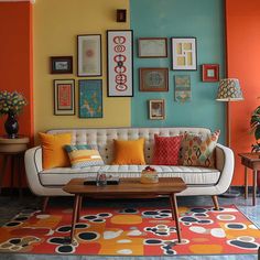 a living room filled with furniture and pictures on the wall above it's coffee table