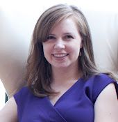 a woman in a purple dress smiling for the camera