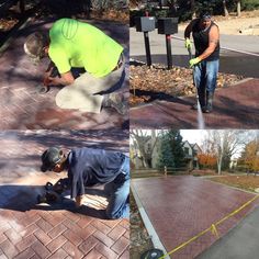 two men are working on a brick walkway