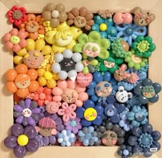 a box filled with lots of different types of buttons on top of a wooden table