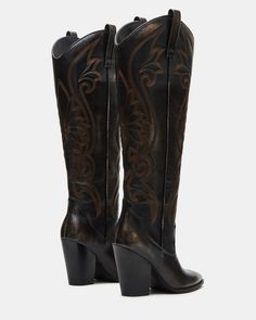 A Western boot is a requirement for any wardrobe and we’re obsessed with LASSO. This knee-high pair features whipstitching detail and a towering block heel. 3.75 inch heel height Size 6 measurements: 17 inch shaft circumference, 13.5 inch shaft height Size 8 measurements: 18 inch shaft circumference, 14.25 inch shaft height Size 10 measurements: 19 inch shaft circumference, 15 inch shaft height Leather upper material Textile and synthetic lining Synthetic sock Synthetic sole Imported Western Boots Women, Western Boot, Wide Calf, Western Boots, Women's Boots, Knee High, Block Heels, Heel Height, Leather Upper