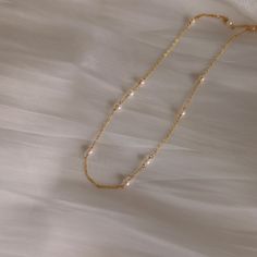 "A dainty floating pearl necklace with an unbalanced design. Made with freshwater pearls and 14k gold filled components. Two styles to choose from. A simple necklace for your daily wear and a lariat design perfect for weddings. She's a matching piece of Gloria Earrings: https://www.etsy.com/ca/listing/1222865266/gloria-pearl-drop-earrings-dainty-pearl Details Genuine freshwater pearl are around 3.5mm. Lariat necklace features 6\" drop.  14k gold filled components (anti-tarnish and hypoallergenic Floating Pearl Necklace, Pearl Lariat Necklace, Pearl Lariat, Floating Necklace, Freshwater Pearl Jewelry, Gold Filled Necklace, Wedding Jewellery Necklace, Lariat Necklace, Simple Necklace