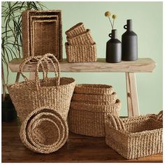 several baskets and vases on a table