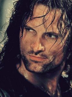 a man with wet hair looking at the camera