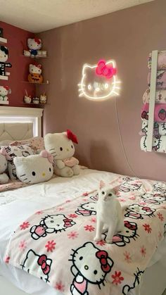 a bedroom with hello kitty bedding and pink walls