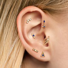 a close up of a person with ear piercings on their left and right ears