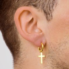 Introducing The Gold Cross Dangle Earring. Made from 925 Sterling Silver with a 14k Gold plating. Paired with a 15MM Silver Hoop earring giving you the option of wearing without the cross.  Also Available in Silver. Materials: 925 Sterling Silver / 18K Gold Plating - 5 Times Plated. Size: 15mm Circumference (Hoop) Closure: Ear wire Weight: 6g Bar size: 1mm (Gauge)  Perfect for Daily wear Packed in a Zip Close Jewellery Pouch These earrings are not included within our lifetime warranty. The 14K G Dangle Cross Earrings, Earrings Mens, Silver Cross Earrings, Silver Hoop Earring, Etsy Jewellery, Earrings Cross, Dangle Hoop Earrings, Cross Earrings, Sterling Silver Cross