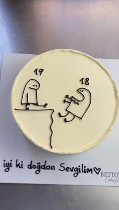 a cake with a drawing of a man and woman on it