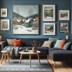 a living room with blue walls and pictures on the wall above the couch, along with two coffee tables