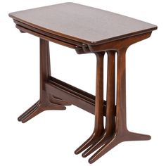 a small wooden table with two legs on it's sides and one leg raised up to the side