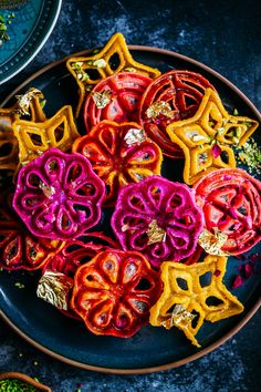 red, yellow and orange food on a plate