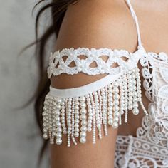 Amazing pair of bridal pearl shoulder jewelry, Bridal Sleeves is the perfect bridal accessory for your boho beach wedding. These bridal pearl arm cuffs are absolutely stunning for you the boho bride on your big day🌺 This stunning pair of fringe bridal pearl bracelet sleeves will be a gorgeous addition to any wedding dress. To give your wedding dress an amazing special addition while walking down the aisle to marry the man of your dreams. 💗💖 Make it unique! It's YOUR day! 💖💗 A stylish additi Pearl White Pearl Bridal Accessories, Pearl White Bridal Pearl Accessories For Wedding, Pearl White Bridal Accessories For Wedding, White Pearl Chain Bracelet For Wedding, Beaded Pearl Bridal Accessories For Wedding, Pearl White Pearl Bracelet For Wedding, White Pearl Embellished Bracelet For Party, White Pearl Drop Bracelet For Party, Wedding Pearl Bracelet In Pearl White