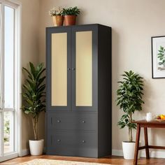 a tall cabinet with two doors in a room next to a table and potted plants