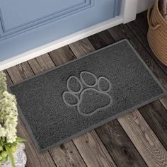 a door mat with a dog paw print on it