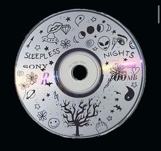 a cd with many symbols on it and the words sleepless nights written all over it