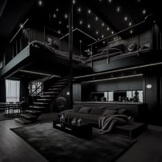 a living room filled with furniture next to a stair case in the middle of a dark room