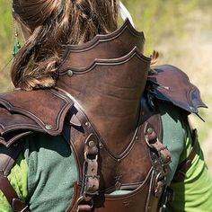 the back of a woman's leather armor