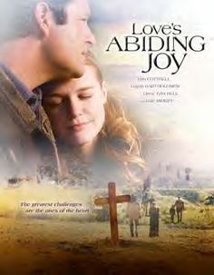 the movie love's abiding joy is shown in front of a cross