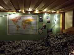 a bed room with a large map on the wall