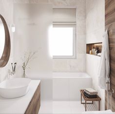 a bathroom with a sink, mirror and bathtub next to a window on the wall