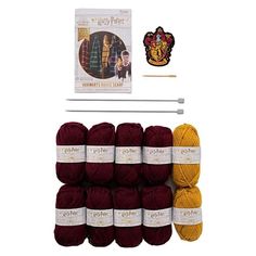 yarn and knitting needles with harry potter's house in the background